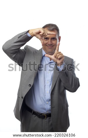 businessman making a frame with his hands 