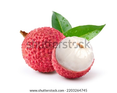 Juicy Lychee with cut in half and leaves  isolated on white background. Clipping path. Royalty-Free Stock Photo #2203264745