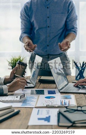 Business team working on calculators and business graph charts. financial accountant assistant Sales manager or marketer in formal attire vertical picture Royalty-Free Stock Photo #2203269159