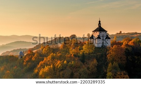 The New Castle in Banska Stiavnica at sunrise in an autumn season, Slovakia, Europe. Royalty-Free Stock Photo #2203289335