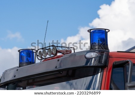 close-up picture of blue lights and sirens on a fire-truck