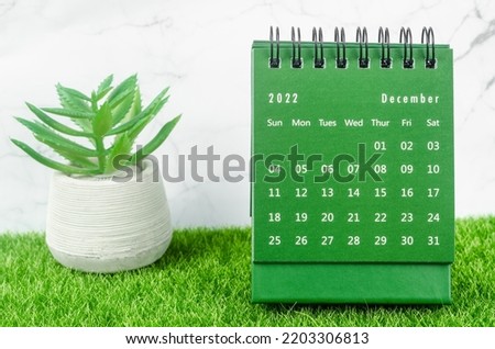 Green December 2022 Monthly desk calendar for 2022 year on grass. Royalty-Free Stock Photo #2203306813