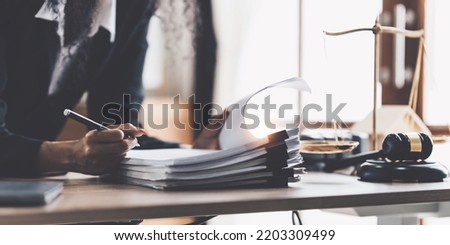 Lawyer business woman working or reading lawbook in office workplace for consultant lawyer concept Royalty-Free Stock Photo #2203309499
