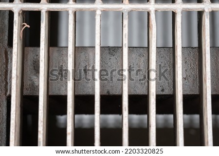 Metal grate structure of drainage waterway of the water treatment processing at the factory plant. Industrial equipment textured and object photo, selective focus.