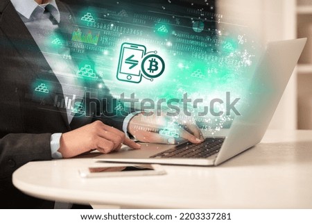 Young man watching stock market on laptop