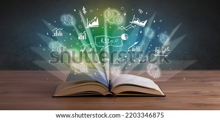 Open book with profit icons above Royalty-Free Stock Photo #2203346875