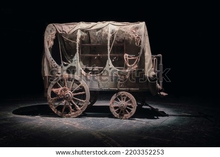 Vintage wooden wagon or carriage on the dark background