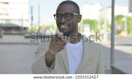 African Man Pointing at the Camera Outdoor