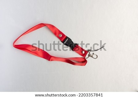 red identification card strap on a white background