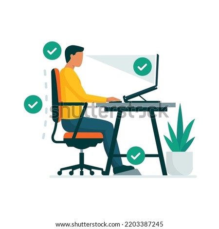 Ergonomic workspace and proper sitting posture at desk, man sitting properly at desk and working with a laptop Royalty-Free Stock Photo #2203387245