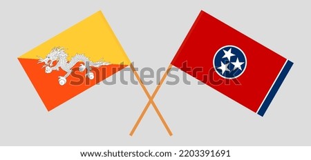 Crossed flags of Bhutan and The State of Tennessee. Official colors. Correct proportion. Vector illustration
