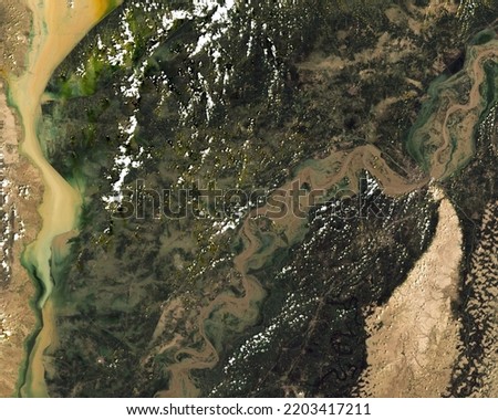 Satellite image of floods in near Sukkur in Pakistan taken on August 28, 2022. Elements of this image furnished by NASA. Royalty-Free Stock Photo #2203417211