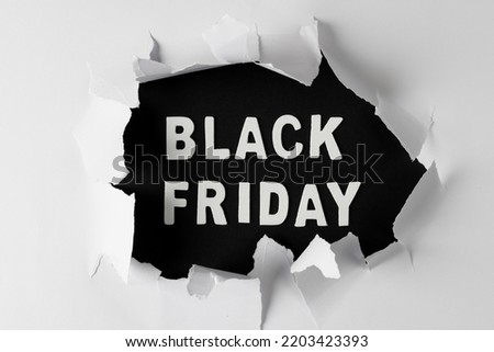 Composition of white paper card and black friday text. Retail, shopping and black friday concept.