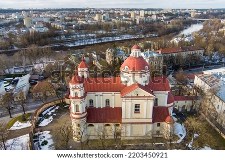 Aerial view of the Church of St. Peter and St. Paul, located in Antakalnis district in Vilnius. Beautiful winter day in the capital of Lithuania. Winter city scenery in Vilnius, Lithuania.