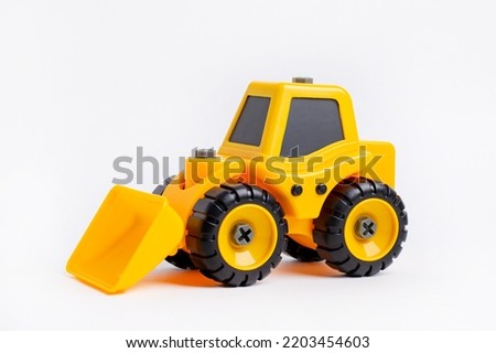 Kids background. Cute colorful background. Tractor car toy yellow in cartoon style on yellow background.