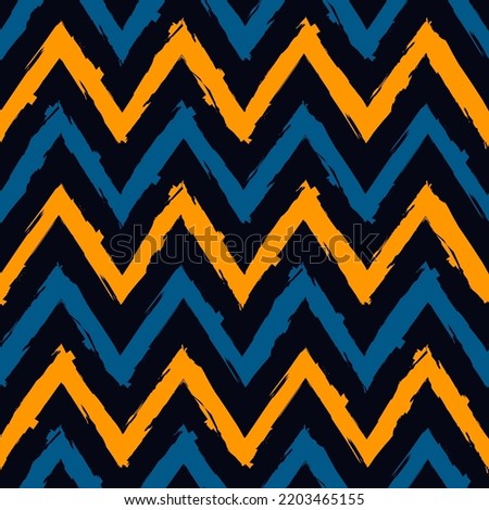 Ethnic seamless pattern. Freehand zigzag stripes print. Boho chic design background. Tribal wallpaper. Brush wavy lines. Handdrawn geometric ornament. Chevron backdrop. Indigenous image