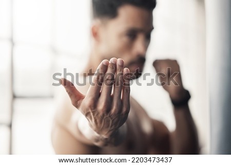 Boxing hands gesture, strong man and fight training of mma athlete, fitness power and sports gym champion. Zoom palm of boxer in fighting stance to approach, attack and impact for karate martial arts Royalty-Free Stock Photo #2203473437