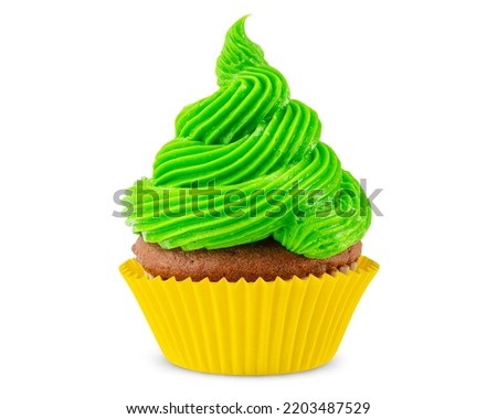Cupcake. Green, yellow cupcake. Idea cooking. Dessert for party. Chocolate muffin decorated with frosting or Icing. Close-up macro high quality and resolution photo. White Isolated background.
