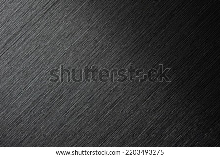 Black brushed metal. Diagonal grain. High resolution brushed metal texture background. Royalty-Free Stock Photo #2203493275