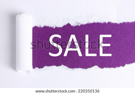 Sale concept. Torn paper with violet background