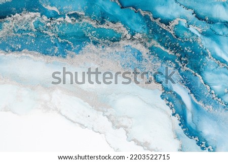 Marble ink abstract art from meticulous original painting abstract background . Painting was painted on high quality paper texture to create smooth marble background pattern of ombre alcohol ink . Royalty-Free Stock Photo #2203522715