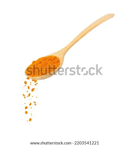 Turmeric powder (Tumeric curcumin, Curcuma longa linn) in wooden spoon isolated on white background. Royalty-Free Stock Photo #2203541221