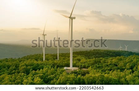 Selective focus on wind farm. Wind energy. Wind power. Sustainable, renewable energy. Wind turbines generate electricity. Windmill farm on mountain. Green technology. Sustainable resources. Royalty-Free Stock Photo #2203542663
