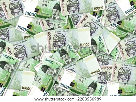 Background of 10000 Won banknote,Group of money stack of 10000 Won Korea banknote a lot of the background texture, top view Royalty-Free Stock Photo #2203556989