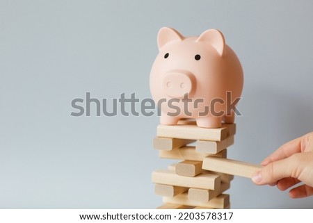 Investment risk and uncertainty in in financial sector. economic crisis, destroying or supporting business with money. Royalty-Free Stock Photo #2203578317