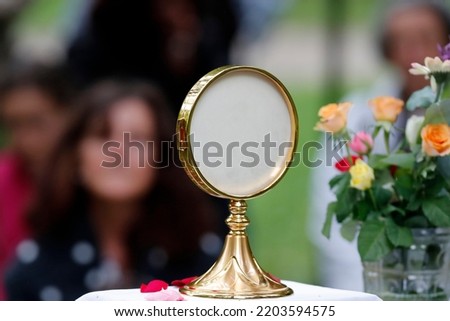 Corpus Christi or Feast of the Blessed Sacrament.  Eucharistic adoration.  La Roche sur Foron. France.  Royalty-Free Stock Photo #2203594575