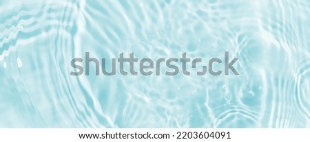 Water panoramic banner background. Water texture, water surface with rings and ripple. Spa concept background. Flat lay, top view, copy space, composition with copy-space. Royalty-Free Stock Photo #2203604091