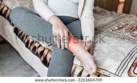 Pregnancy pain leg woman. Pregnant girl have leg disease, ankle pain doing health massage exercise. Foot swelling during pregnancy Royalty-Free Stock Photo #2203604709