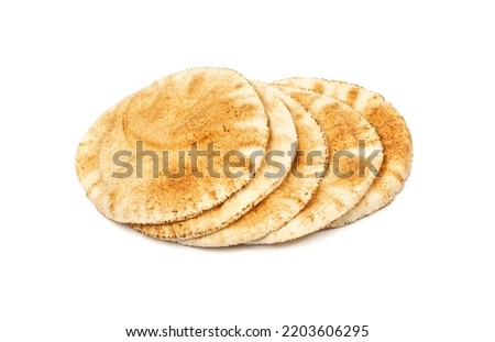 Wheaten Pita Flat Bread Stack Isolated. Flatbread also known as Pita Bread, Chapati, Naan, Tortilla Pile on White Background Royalty-Free Stock Photo #2203606295