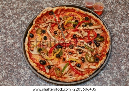 Freshly made delicious thin crust Mexican Pizza. Selective focus is in center, A little depth of field