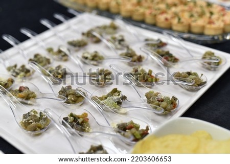 Snacks on the table consisting of chicken meat and vegetables are ready for presentation