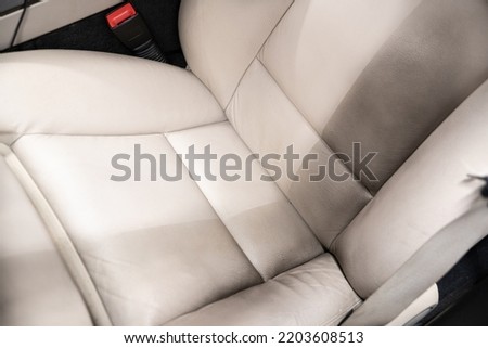 Effect before and after cleaning the leather driver seat Royalty-Free Stock Photo #2203608513