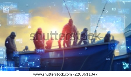 Fishermen on a fishing boat and technology. Wide angle visual for banners or  advertisements. Royalty-Free Stock Photo #2203611347