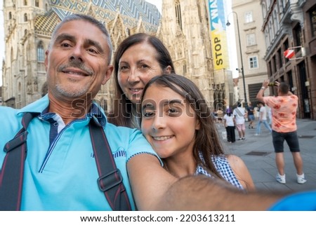 Happy family visiting european city stop war sign on the background.