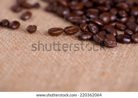 roasted coffee bean on sackcloth background 