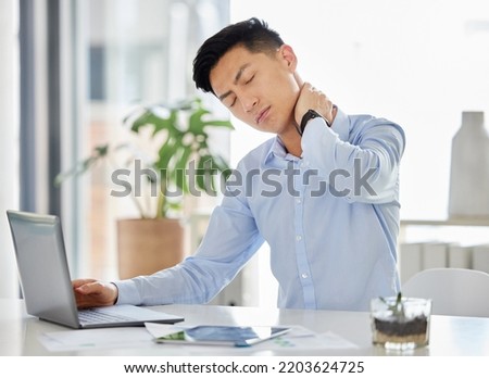 Stress, burnout and neck pain Asian man with headache, anxiety and depression working with laptop on report, tax or audit in office. Frustrated and tired business man with mental health overworked Royalty-Free Stock Photo #2203624725