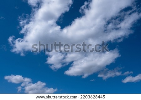 white clouds in the blue sky. cumulus. Royalty-Free Stock Photo #2203628445