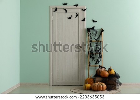 Interior of hall decorated for Halloween with door and ladder