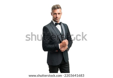 mature guy in bow tie suit. businessman isolated on white. gentleman in formal wear Royalty-Free Stock Photo #2203641683