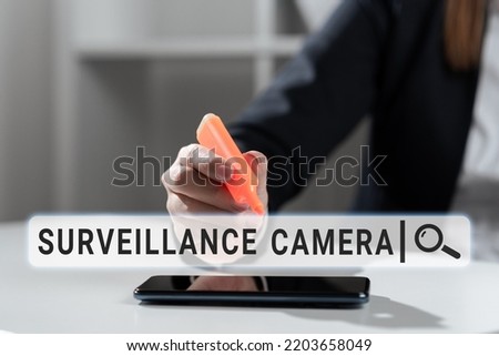 Text caption presenting Surveillance Camera. Business showcase Closed Circuit Television transmit signal on monitors