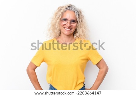 Middle age caucasian woman isolated on white background confident keeping hands on hips.