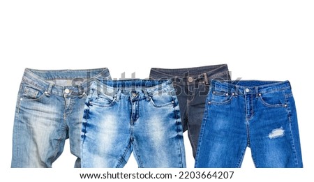 Blue jeans denim set isolated on white background with copy space. Top view and mock up clothes. Male female pants collage isolate. Autumn wear clothing