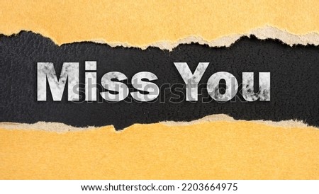 Abstract word miss you label torn paper recycled brown pieces on background. 
Old kraft ripped paper scrap box craft banner alphabet miss you pattern. Royalty-Free Stock Photo #2203664975