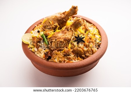 Dum Handi chicken Biryani is prepared in an earthen or clay pot called Haandi. Popular Indian non vegetarian food Royalty-Free Stock Photo #2203676765