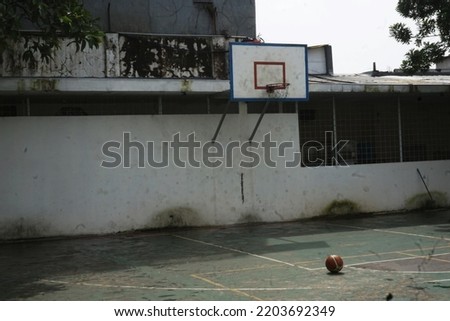 an abandoned and scary basketball court