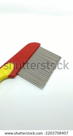 Colorful comb anti flea for  cat on white background